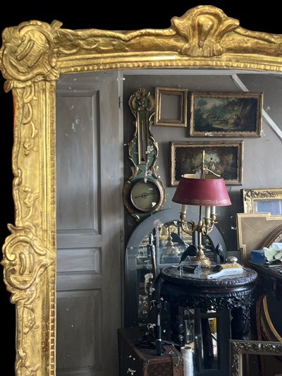 LARGE XVIIIth CENTURY MIRROR IN GOLDEN SCULPTURED AND STUQUED WOOD WITH MERCURY ICE