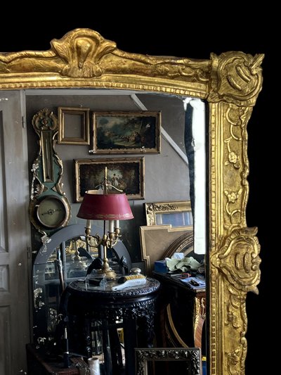 LARGE XVIIIth CENTURY MIRROR IN GOLDEN SCULPTURED AND STUQUED WOOD WITH MERCURY ICE