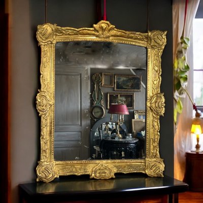 LARGE XVIIIth CENTURY MIRROR IN GOLDEN SCULPTURED AND STUQUED WOOD WITH MERCURY ICE