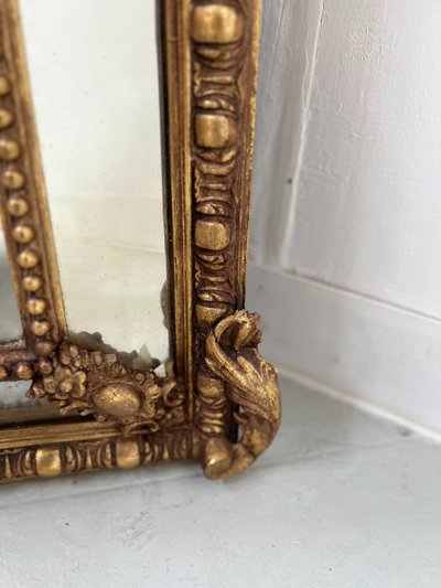 Miroir a pare closes de style Louis XVI en bois et stuc doré XIX siècle