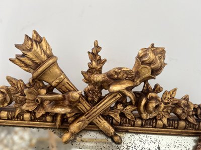 Miroir a pare closes de style Louis XVI en bois et stuc doré XIX siècle