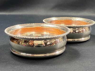 Pair of Louis XV style silver-plated metal coasters