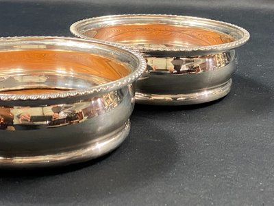 Pair of Louis XV style silver-plated metal coasters