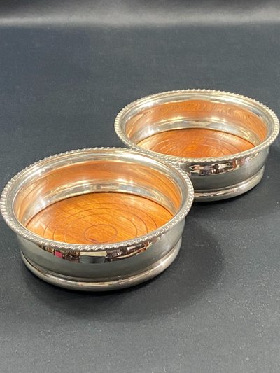 Pair of Louis XV style silver-plated metal coasters