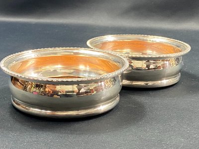 Pair of Louis XV style silver-plated metal coasters