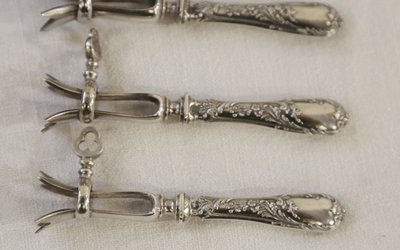 Set aus 6 Kotelettzangen Massivsilber