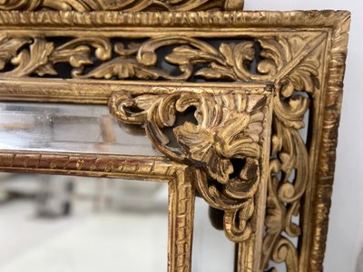 Miroir a pare closes de style Louis XIV en bois et stuc doré XIX siècle