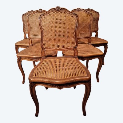 Suite de six chaises cannées en hêtre de style Louis XV.
