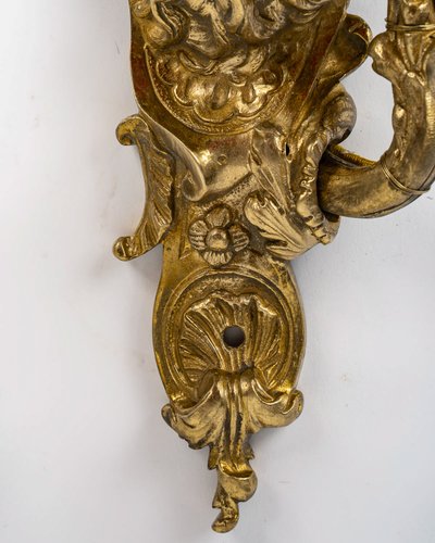 Paar Wandleuchten, genannt Aux Zéphyrs, aus ziselierter und vergoldeter Bronze XIX.