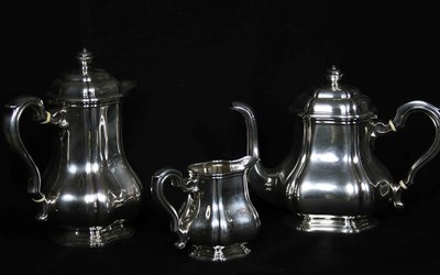Served in solid silver tea, coffee and sugar pot