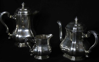 Served in solid silver tea, coffee and sugar pot
