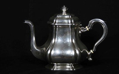Served in solid silver tea, coffee and sugar pot