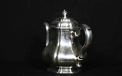Served in solid silver tea, coffee and sugar pot