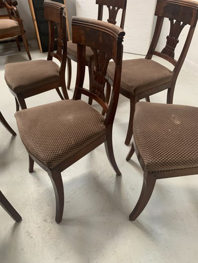Suite of seven solid mahogany chairs XIX century