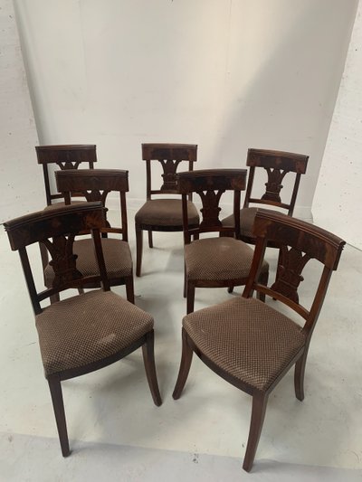 Suite of seven solid mahogany chairs XIX century