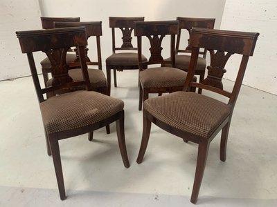 Suite of seven solid mahogany chairs XIX century