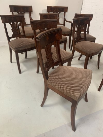 Suite of seven solid mahogany chairs XIX century