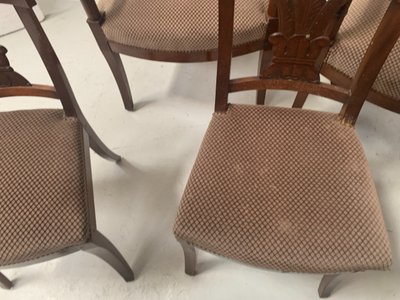 Suite of seven solid mahogany chairs XIX century