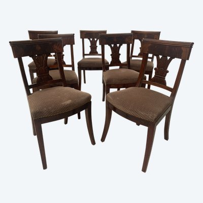 Suite of seven solid mahogany chairs XIX century