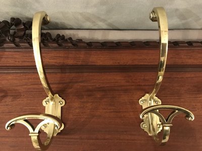 Set of 6 19th century bronze coat hooks on wood
