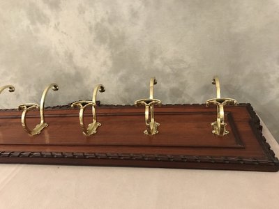Set of 6 19th century bronze coat hooks on wood