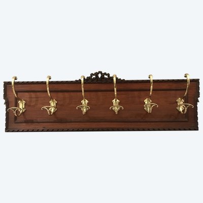 Set of 6 19th century bronze coat hooks on wood