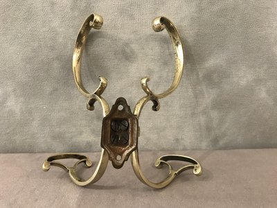19th century double coat hook in polished and varnished brass