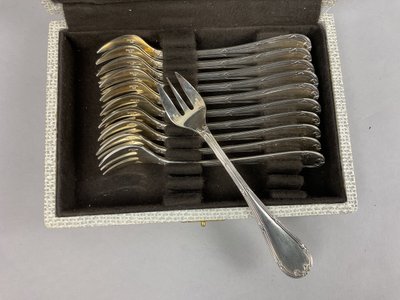 Twelve Christofle cross ribbon oyster forks