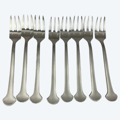 Eight cake forks, steel, Christophe sigma.