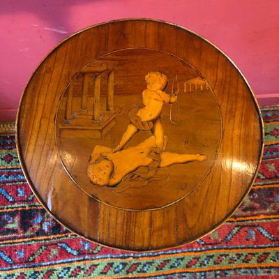 Marquetry pedestal table with putti, late 19th century