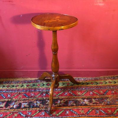 Marquetry pedestal table with putti, late 19th century