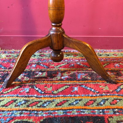 Marquetry pedestal table with putti, late 19th century