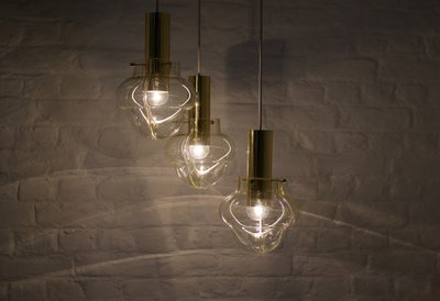 Venini amber three-globe pendant light