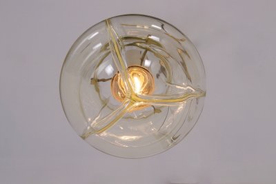 Venini amber three-globe pendant light