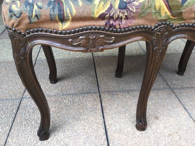 A Louis XV bench with its Aubusson tapestry