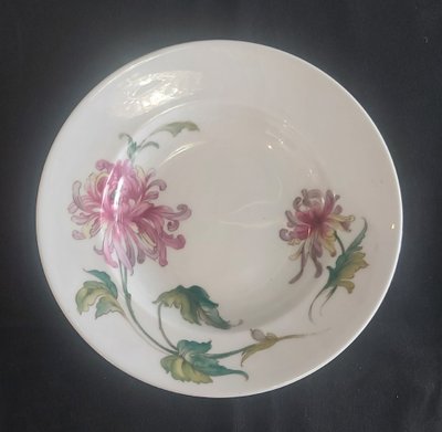 Quattro piatti in porcellana della casa Tharaud di Limoges
