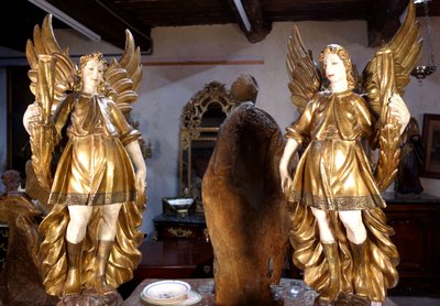 Large pair of gilded wooden torch-bearing angels, 18th century