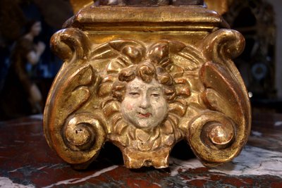 Large pair of gilded wooden torch-bearing angels, 18th century