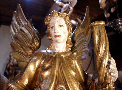 Large pair of gilded wooden torch-bearing angels, 18th century