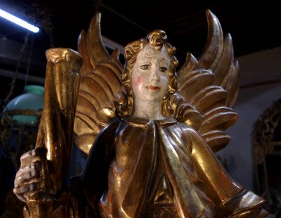 Large pair of gilded wooden torch-bearing angels, 18th century