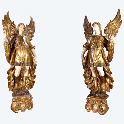 Large pair of gilded wooden torch-bearing angels, 18th century
