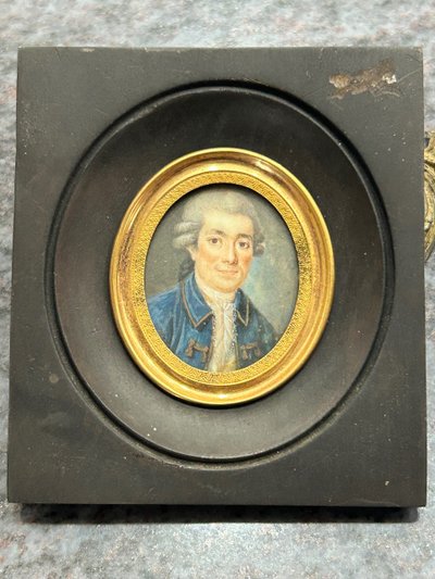 Miniature portrait of a man in a blue jacket from the late 18th century