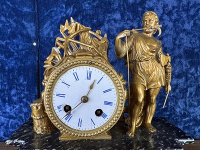 Napoleon III period clock in faux marble painted wood and gilded regule