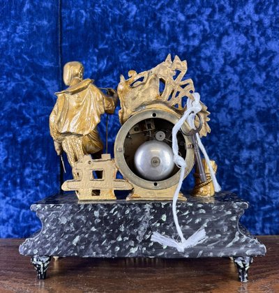 Napoleon III period clock in faux marble painted wood and gilded regule