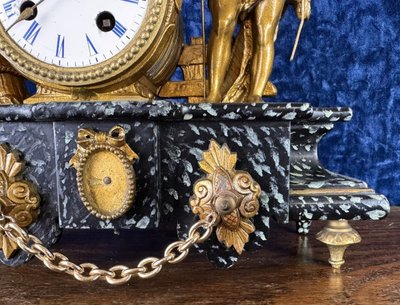 Napoleon III period clock in faux marble painted wood and gilded regule