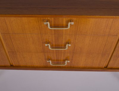 Modernistisches Sideboard mit Messing-Kompassfüßen.