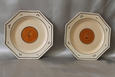 Pair of Nevers earthenware ocotogonal beaded plates signed Dubois 18th century