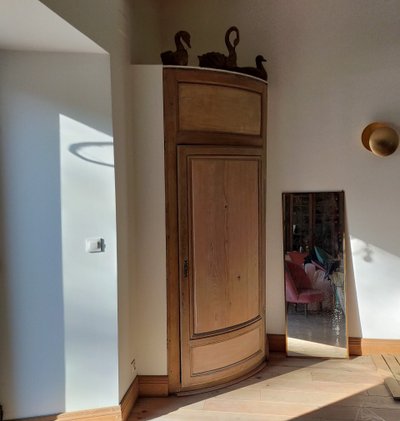Two antique oak cornerboards curved cupboard doors