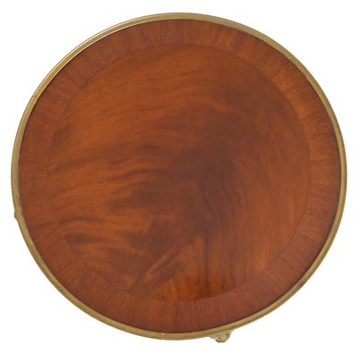 Guéridon en placage de bois de rose et ornementation de bronze doré à décor de têtes de béliers