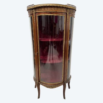 Napoleon III-style display cabinet in mahogany and veneer It opens with a curved glass door on the front.